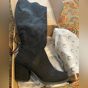 Tall black suede boots